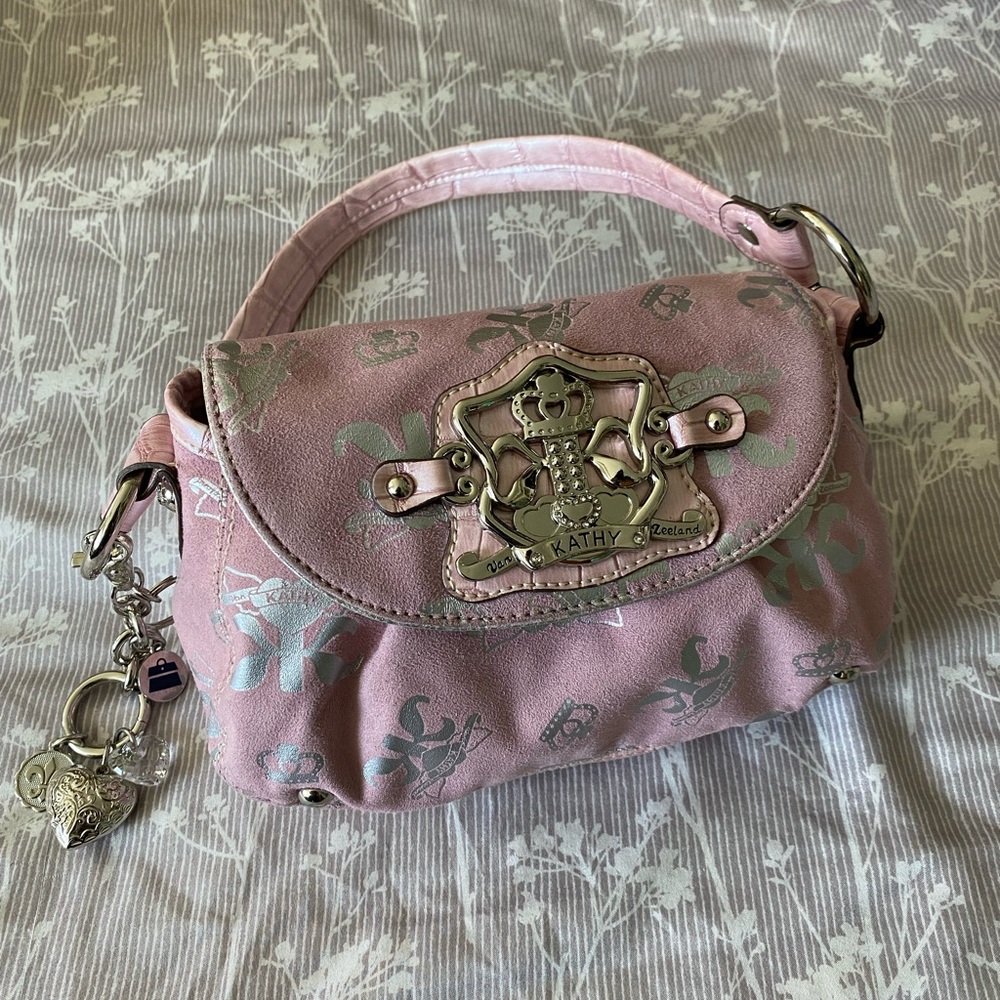 Kathy Van Zeeland pink and silver handbag.